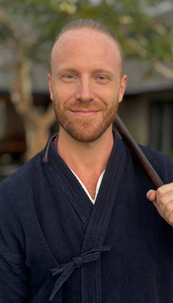 Portrait of Maxim Lewis in traditional practice attire